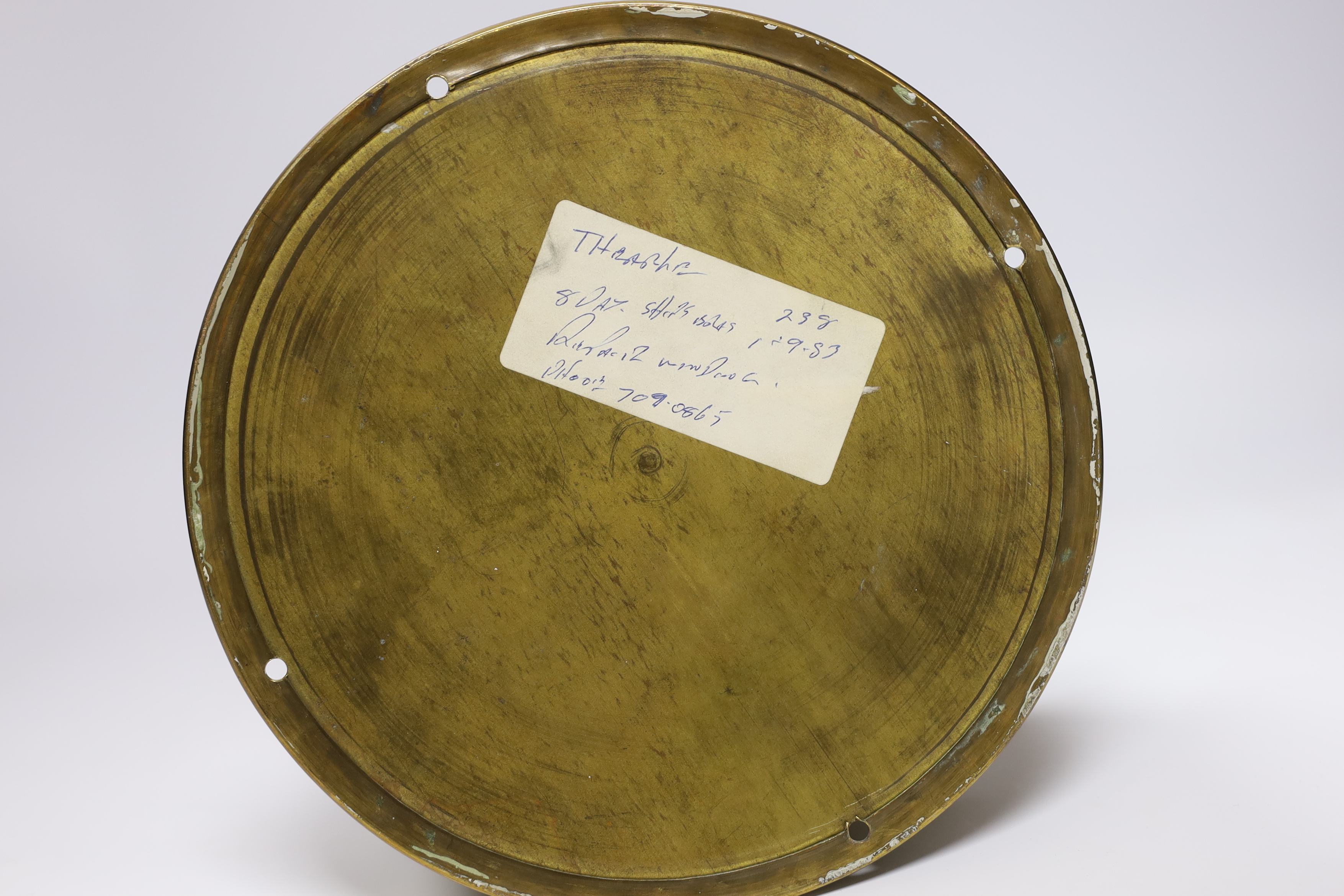 A brass ships bulkhead timepiece, by Smith & Chalmers, Southampton, base plate 19.5cm diameter